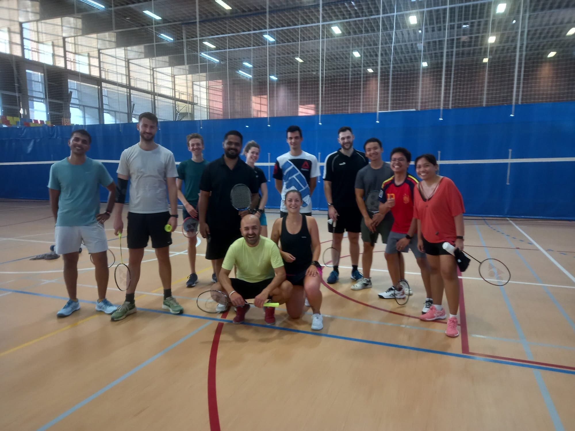 Keep Calm Community Barcelona Friday badminton group with rackets at La Mar Bella, Poblenou