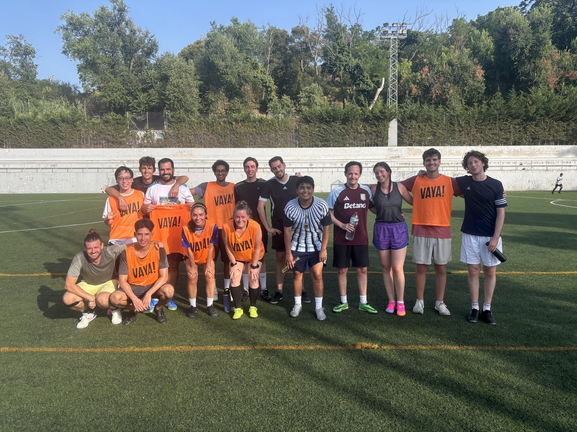 Keep Calm Community Friday football group photo on the Montjuïc pitch in Barcelona
