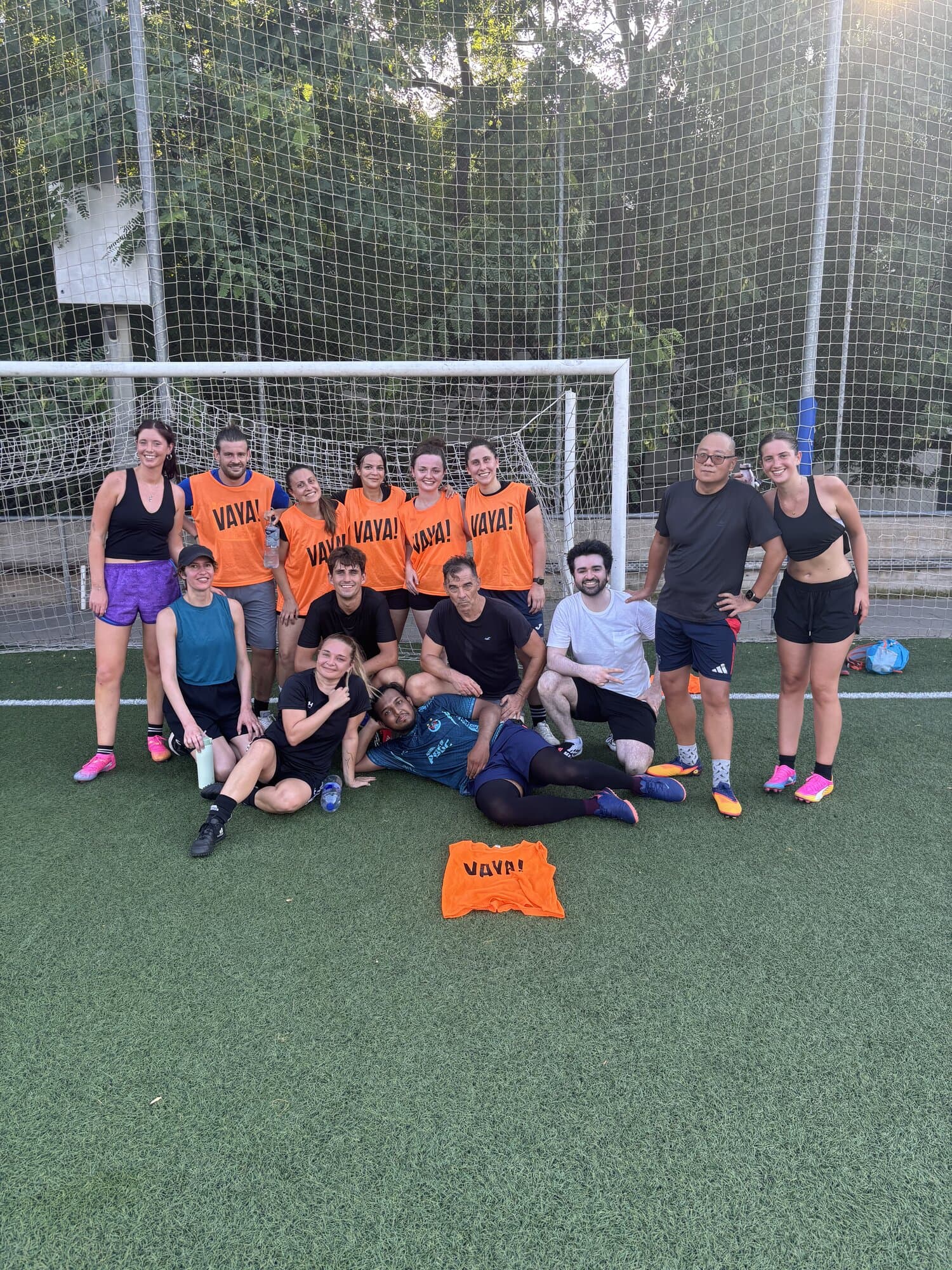 Keep Calm Community Friday football group photo wearing Vaya Sports bibs by the goal in Barcelona
