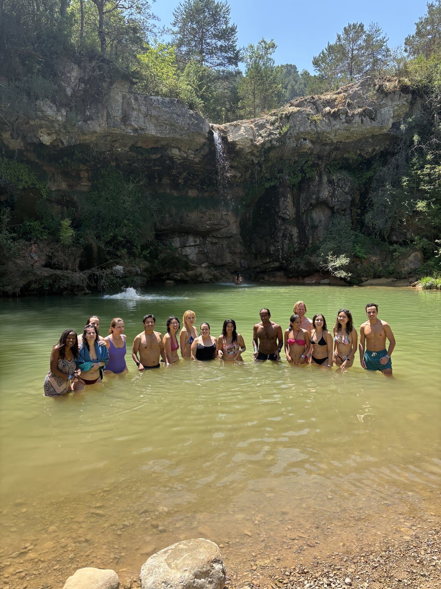 Keep Calm Community hikers swimming at the 7 Gorges waterfalls near Campdevànol
