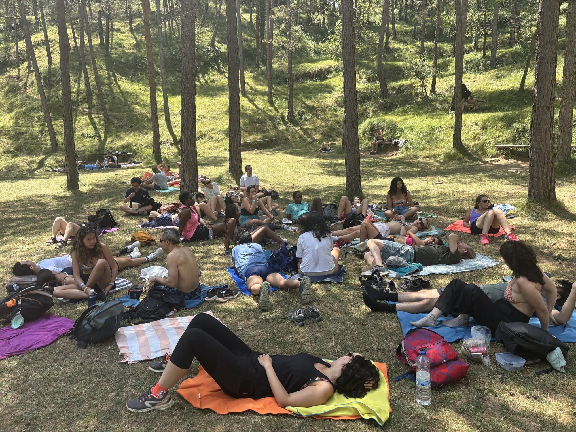 Keep Calm Community hikers resting in the woods on the 7 Gorges hike