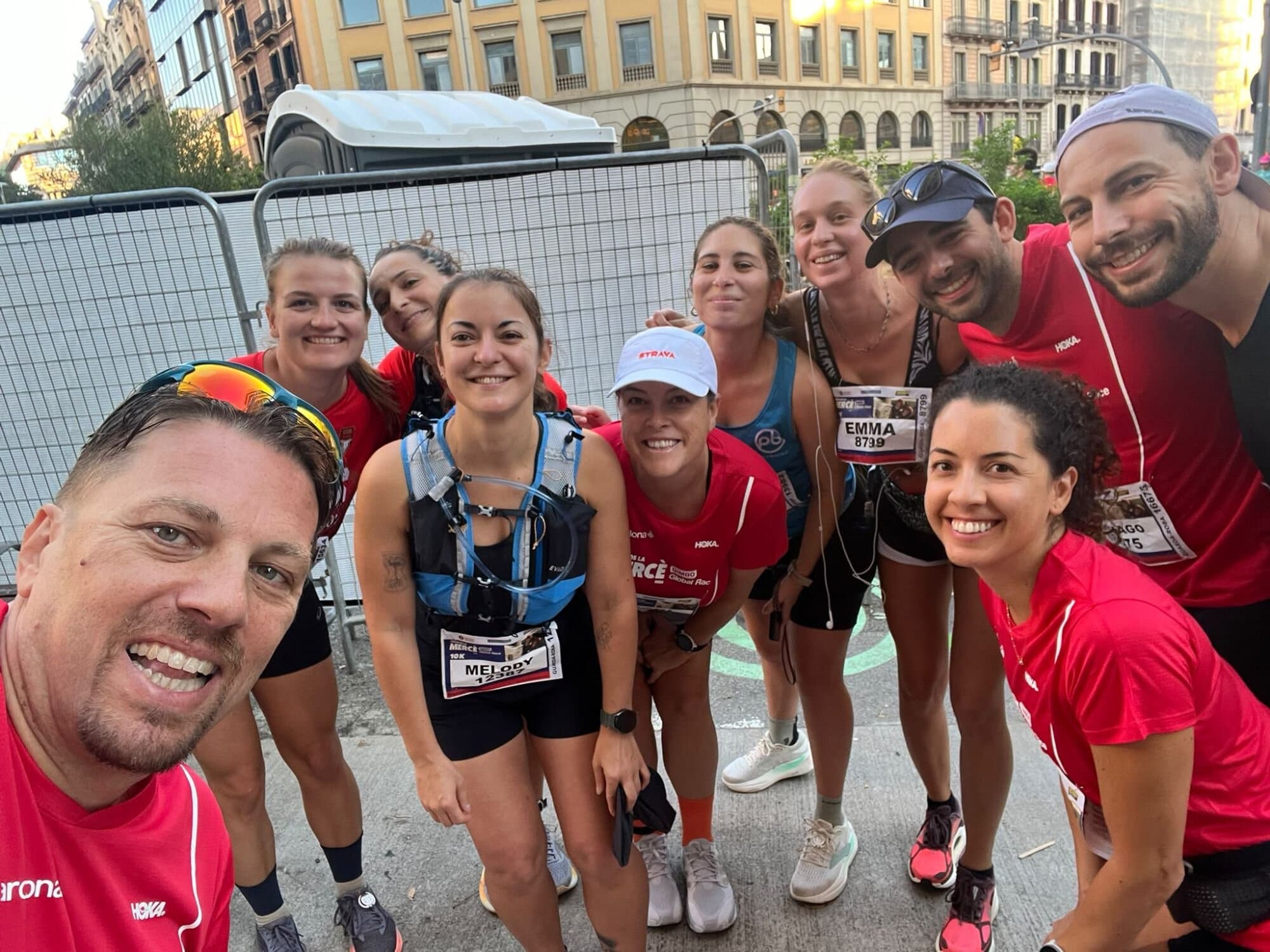 Keep Calm Running group celebrating together after finishing the Cursa de la Mercè race in Barcelona