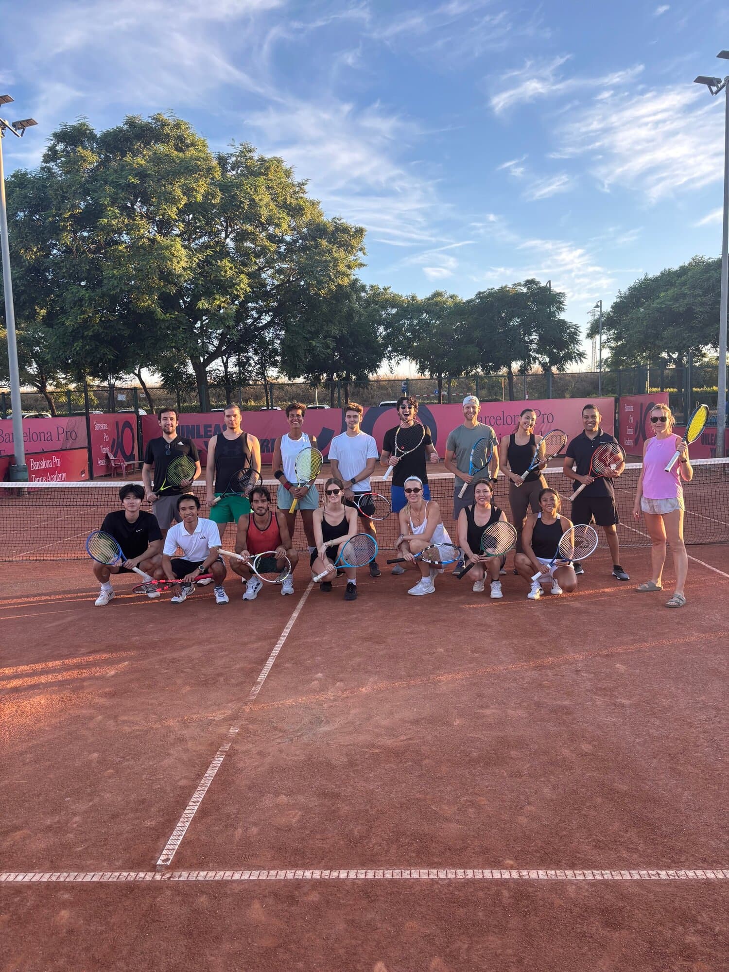 Keep Calm Community Tuesday tennis group at sunset on the clay courts at Barcelona Pro Tennis Academy, Up Cornellà, Barcelona