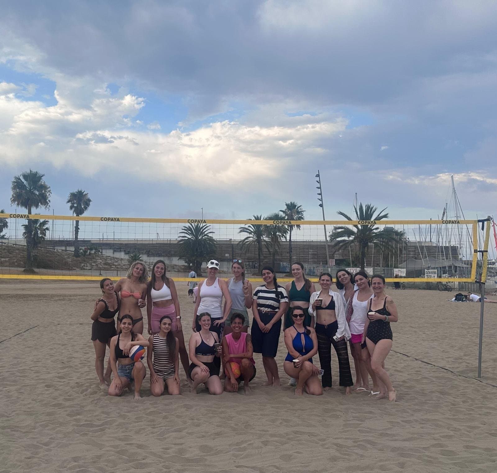 Keep Calm Women's Volleyball group at the net, Barcelona