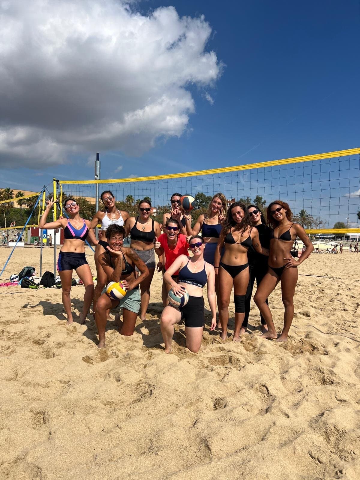 Keep Calm Women's Volleyball group by the net at the beach, Barcelona